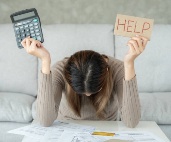 Stressed and headache asian woman with large bills or invoices no money to pay to expenses and credit card debt. shortage, Financial problems, mortgage, loan, bankruptcy, bankrupt, poor, empty wallet